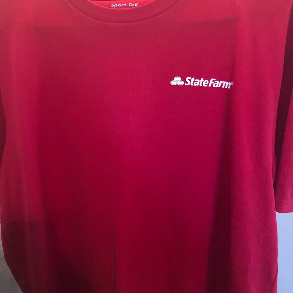 State Farm shirt.